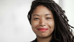 Smiling woman at her desk.