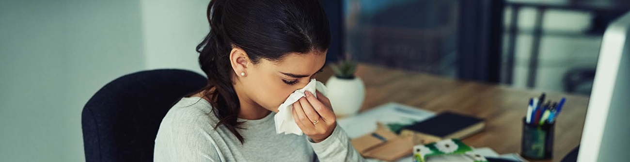 woman sneezing